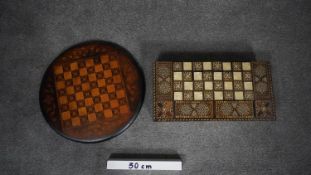 A micro mosaic Indian inlaid marquetry draughts set with draughts along with a Victorian inlaid