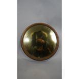 A 19th century Elkington &Co painted gilt silver plate round mirror with mahogany back and gilt