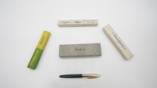 A collection of five boxed vintage pens and pencils. Including a boxed Parker Slimfold fountain pen,