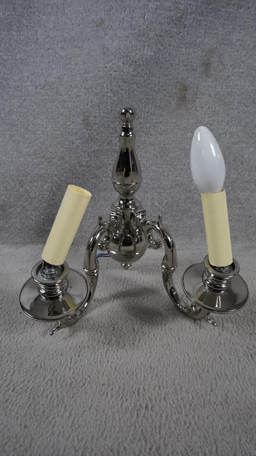 A set of four metal twin sconce wall candelabras with scrolling foliate arms. H.31 W.29 - Image 3 of 8