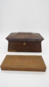 A Regency rosewood sarcophagus shaped tea caddy with lidded compartments to the inside along with