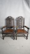 A pair of 19th century oak Carolean style throne armchairs with carved backs and leather