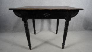 A late Victorian ebonised side table fitted with frieze drawer on turned tapering supports. H.66 W.