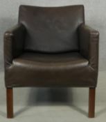 A Heal's tub armchair in tobacco upholstery on square supports. H.75cm