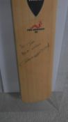 A box framed Wormwood 'The Wand' cricket bat signed and inscribed by England cricketer Andrew