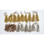 Fifteen bunches of vintage bright cut gold and silvered coloured seed beads along with a bag of