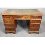 A Georgian style mahogany three section desk with inset leather top on bracket feet. h.78 w.122 d.62