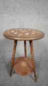 A 19th century rosewood occasional table profusely inlaid with acanthus, swag and musical instrument