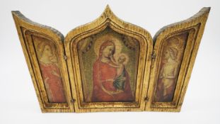 A printed triptych religious idol on wood with gilt borders.