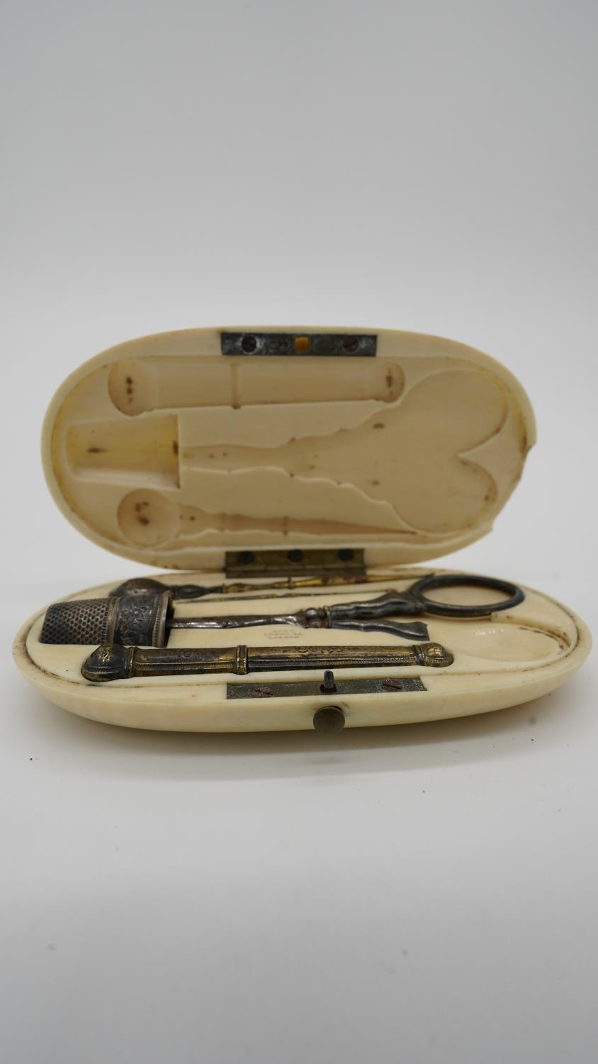 A 19th century French ivory cased pocket sewing kit complete with all components to include needle