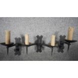 Three refectory aged wrought iron Gothic candle design wall lights. One with two branches and two