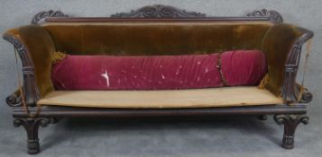 An Irish Regency sofa with carved mahogany frame, in need of reupholstery. H.97 W.210 D.70cm