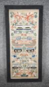 A 19th century silk Chinese embroidery panel mounted on board with flowers and offerings, using