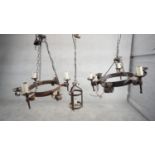 Two Tudor style wrought iron six branch hanging ceiling lights along with a cast iron lantern