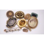 A collection of antique brooches. Including a faux cameo brooch, a seed pearl and turquoise set gold