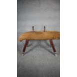 An early 20th century Niels Larsen pommel horse with adjustable legs and handles in suede with