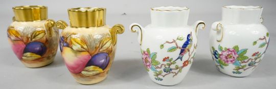 Two pairs of Aynsley twin handled vases. One decorated with 'Orchard Gold' pattern, the other