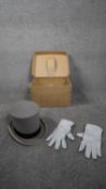 A Herbert Johnson of Bond Street antique boxed pale grey top hat with silk brocade rim and band.