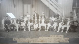 A framed and glazed C.1900 black and white cricket team photo with players signatures underneath.