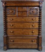 A 19th century mahogany Scottish chest of drawers with and arrangement of drawers flanked by