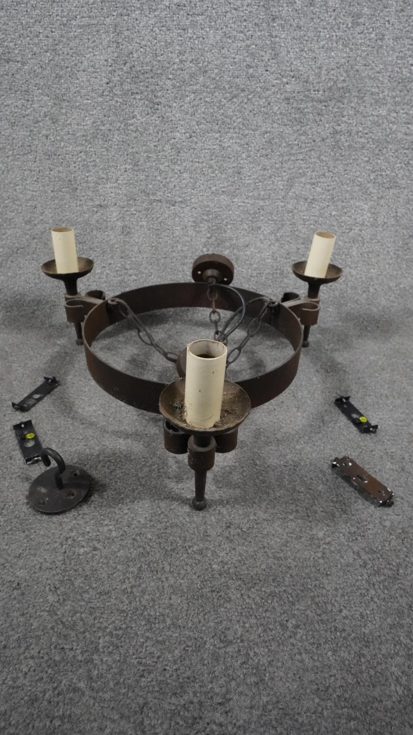 A Tudor style wrought iron three branch hanging candle design ceiling light. H.23 W.53 D.46