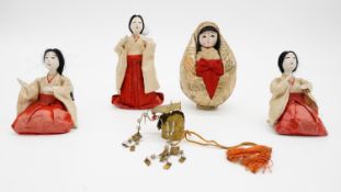 A collection of four antique Japanese ceremonial dolls, one with a articulated metal headdress. With