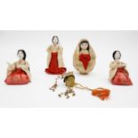 A collection of four antique Japanese ceremonial dolls, one with a articulated metal headdress. With