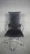 A Charles and Ray Eames inspired Aluminium Group desk chair with swivel and tilt action in black