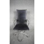 A Charles and Ray Eames inspired Aluminium Group desk chair with swivel and tilt action in black