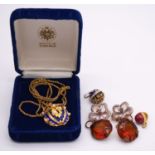 A boxed House of Faberge silver gilt royal blue enamel egg pendant on silver gilt rope chain, the