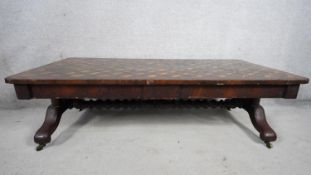 A 19th century rosewood, satinwood and ebony marquetry topped low table on bobbin stretchered