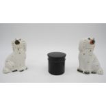 A fair of Staffordshire ceramic dogs and an ebony Victorian screw lidded pot. H.13.7 W.10