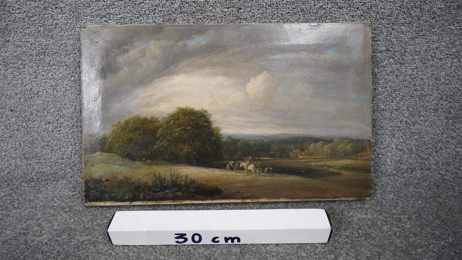 A 19th century oil on canvas of a countryside landscape with workers in the field and man on a - Image 3 of 3