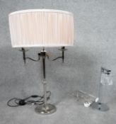 Two contemporary chrome table lamps. One with ice cube glass shade and one with two branches. H.81