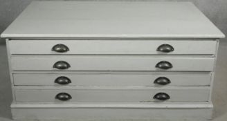 A vintage painted low plan chest of four drawers on plinth base. H.55 W.120 D.80cm