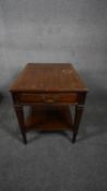 A 19th century Continental style mahogany bedside table fitted with frieze drawer on square tapering