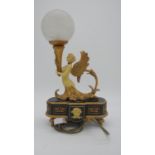 A gilded resin contemporary light in the style of a French ormolu candlestick, with frosted glass