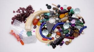 A large collection of loose gemstones and other minerals. Including coral beads, antique ivory