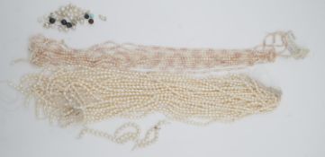 A collection of strung and loose cultured and natural pearls. Including 25 strings of cultured