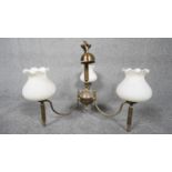 A three branch brass hanging ceiling light with three blown milk glass shades with fluted edge. H.50