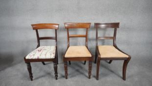 A near pair of mid 19th century mahogany bar back dining chairs along with a Regency style dining