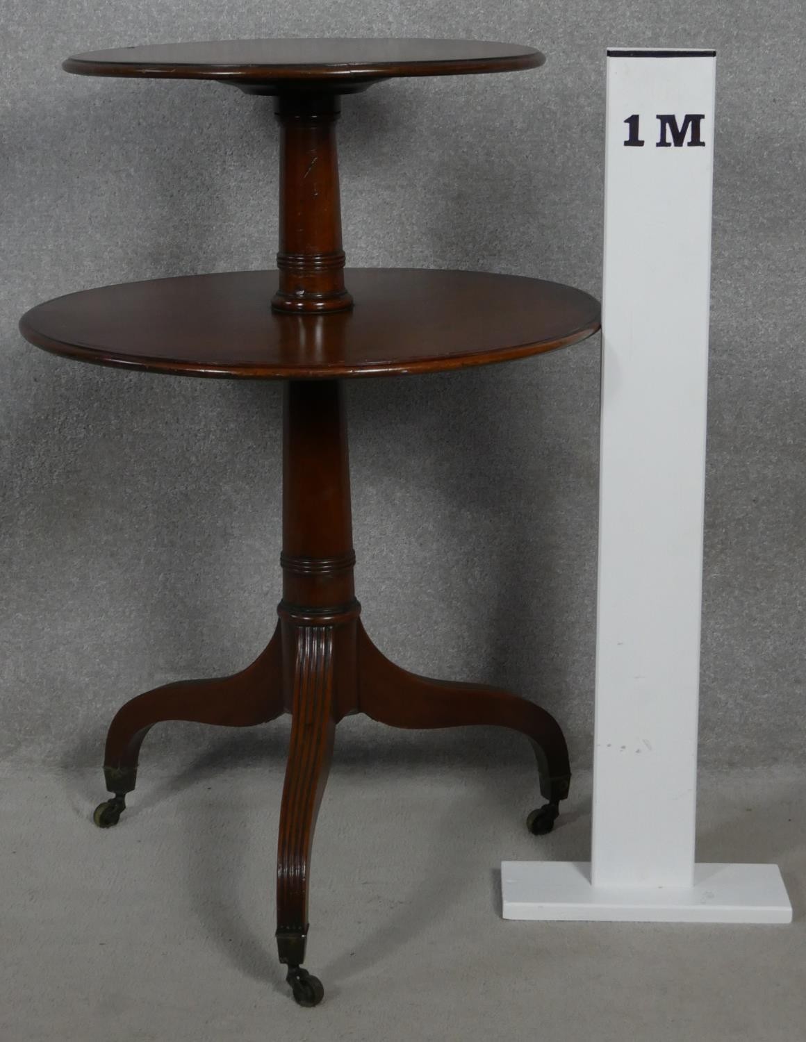 A late Georgian mahogany two tier dumb waiter on turned column and reeded tripod supports - Image 4 of 4