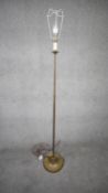 A vintage solid brass weighted base height adjustable standard lamp with silk wrapped cord. H.151