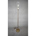 A vintage solid brass weighted base height adjustable standard lamp with silk wrapped cord. H.151