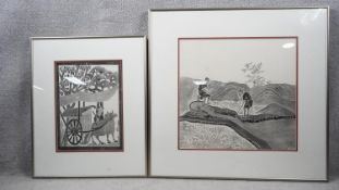 Two framed and glazed Chinese wood block prints. One of two rice farmers watering paddy fields and