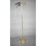 A 1970's Holtkoetter pharmacy brass floor lamp designed and made in Germany by Holtkoetter