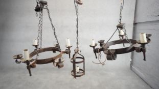 Two Tudor style wrought iron six branch hanging ceiling lights along with a cast iron lantern
