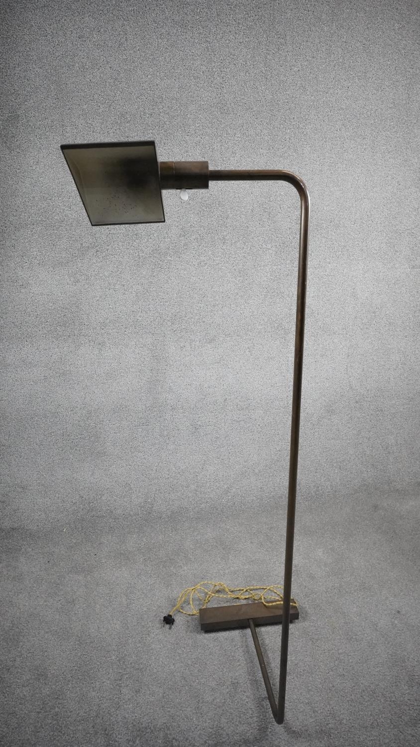 A Mid Century Cedric Hartman style 1UWV bronze effect floor lamp. The bronze triangular shade has