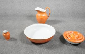 A Victorian A.E. Gray and Co Ltd orange lustre ceramic wash bowl, jug, vase and other ceramic items.