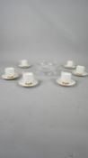 A set of six Aynsley porcelain gilded tea cups and saucers along with a boxed Edinburgh crystal